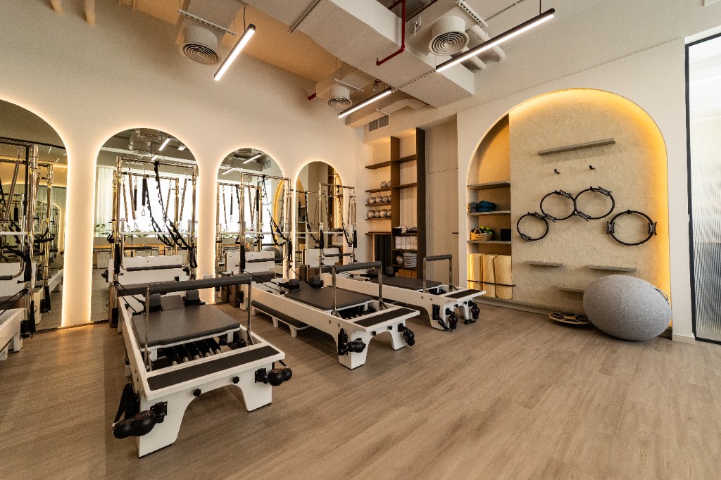 Pilates Academy Meydan reformer studio with arched lighting